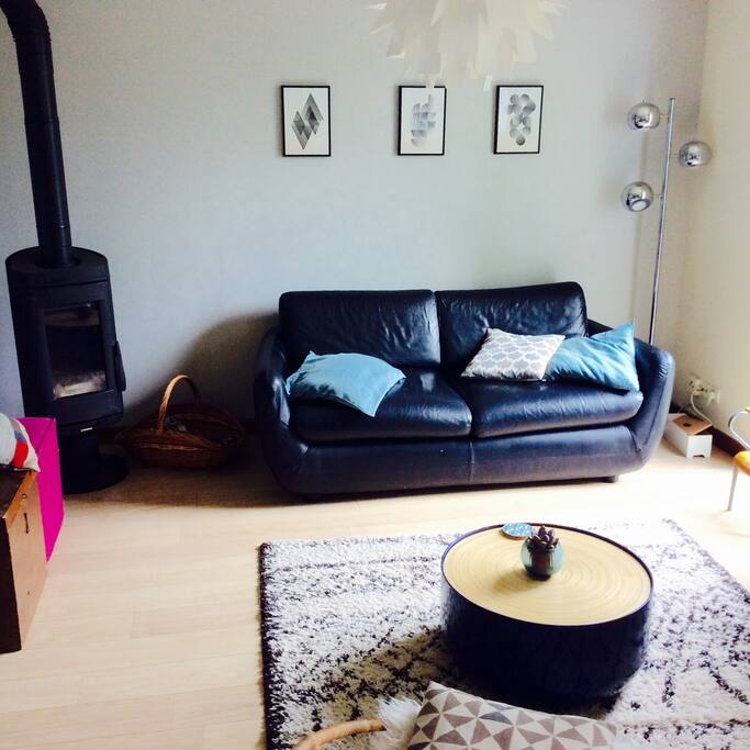 The space sofa, TV with the wood stove