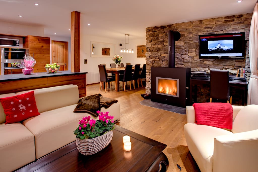 Living room with fireplace and terrace.