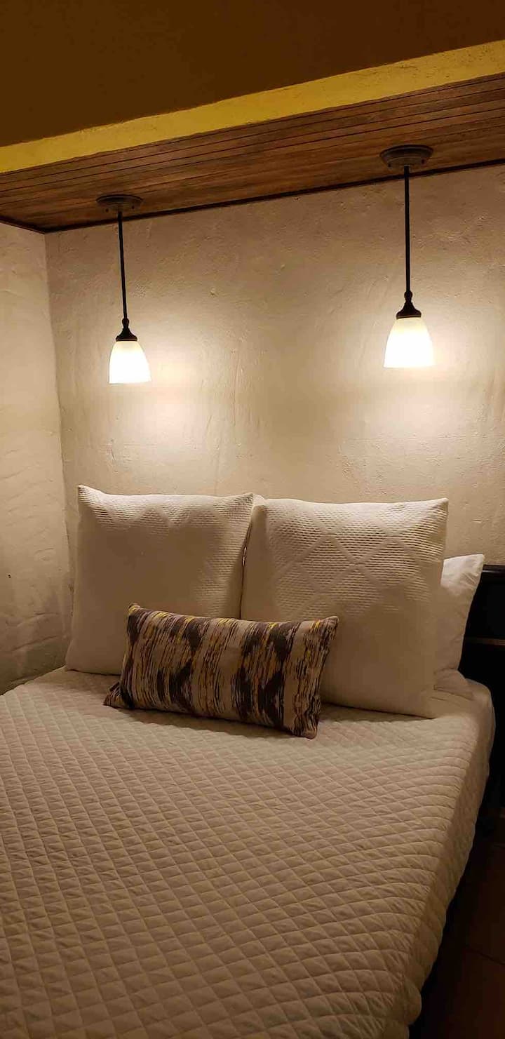 One separate bedroom with a full size bed and A/C Split Unit.