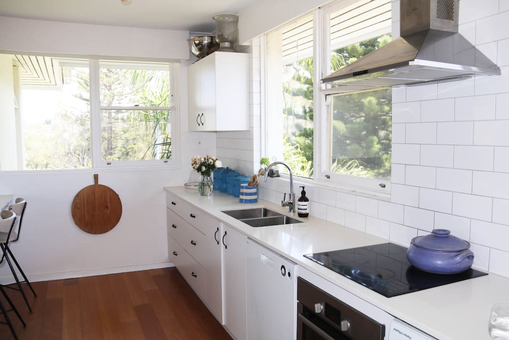 Kitchen with south and west facing windows, allowing breeze and all day natural light.