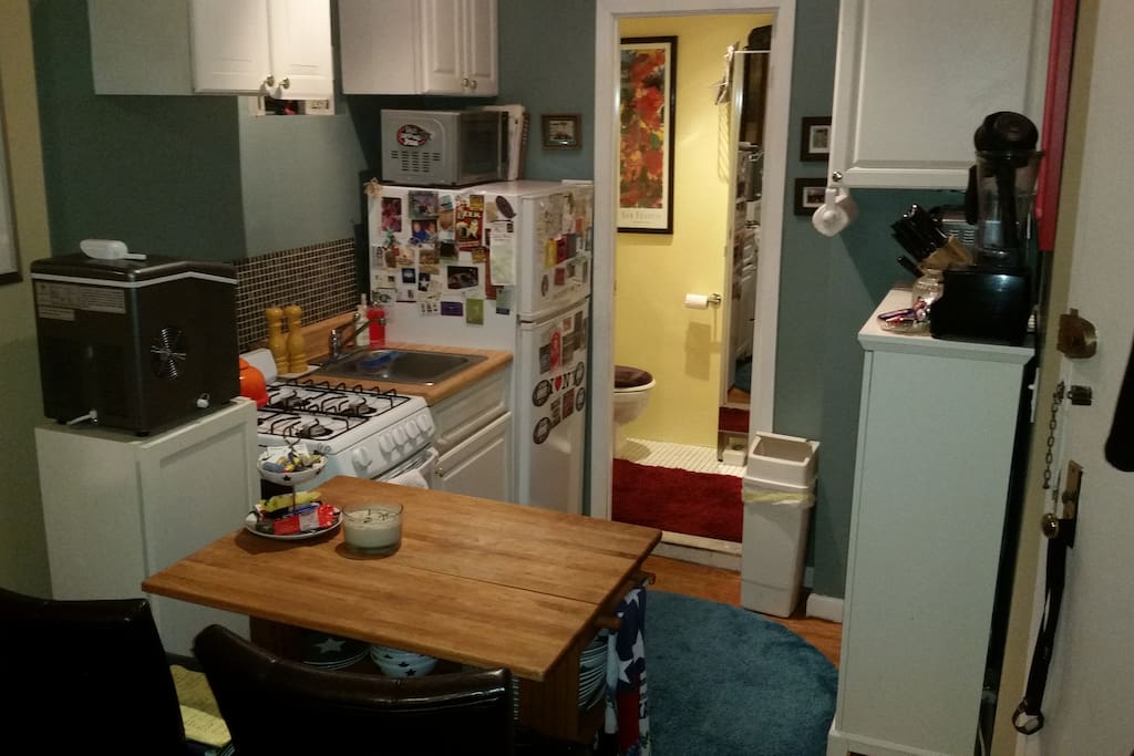 Small, but fully functional kitchen with gourmet accessories, comfy eating/working area, ice machine, and full-size refrigerator