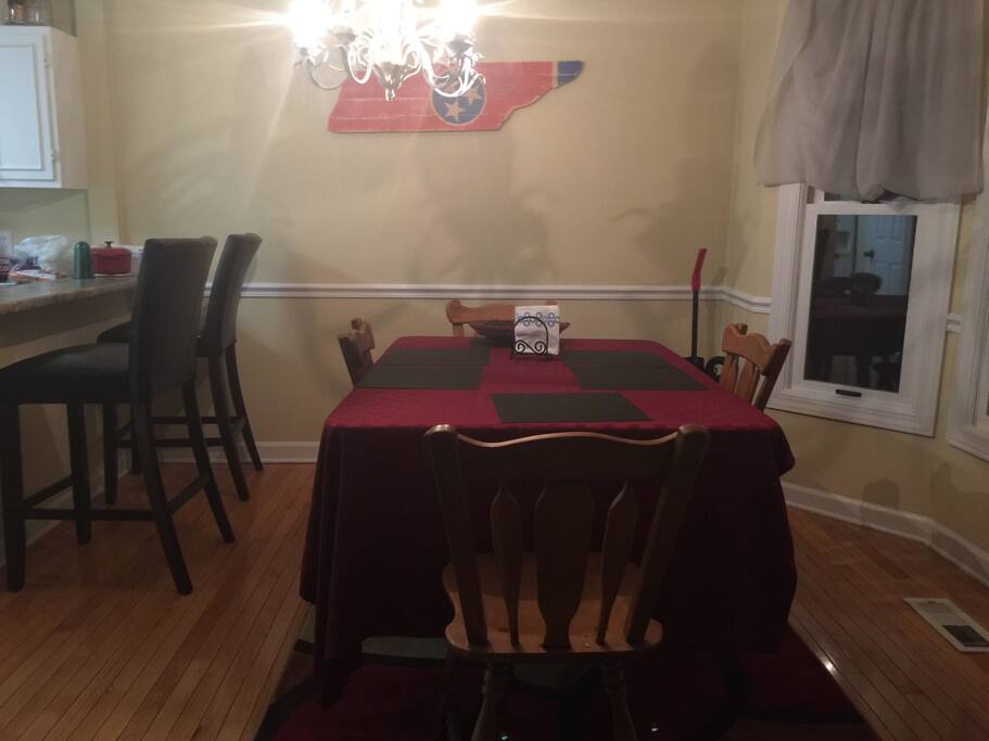 Solid wood dining room table and chairs. With bar chairs, seats six very comfortably.