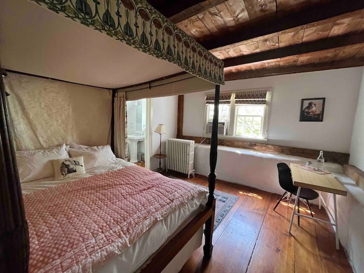 Bedroom with Queen Bed, Creek views, and en suite bath with soaking tub and shower