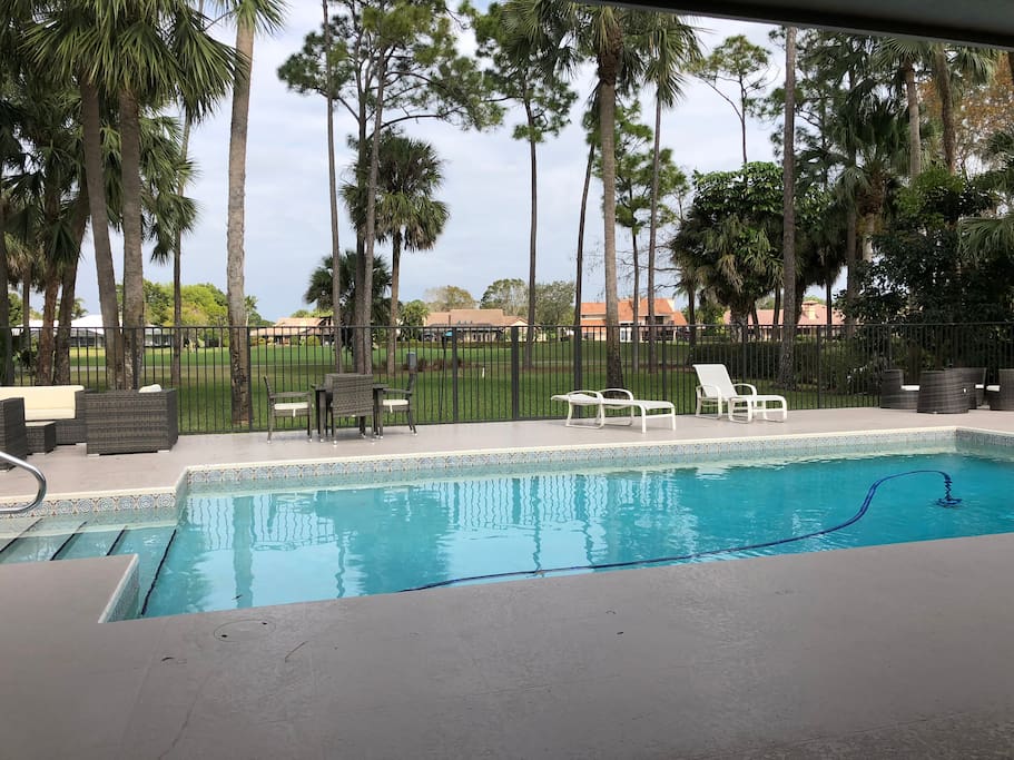 Huge inground pool and deck overlooking the Squire Golf Course.