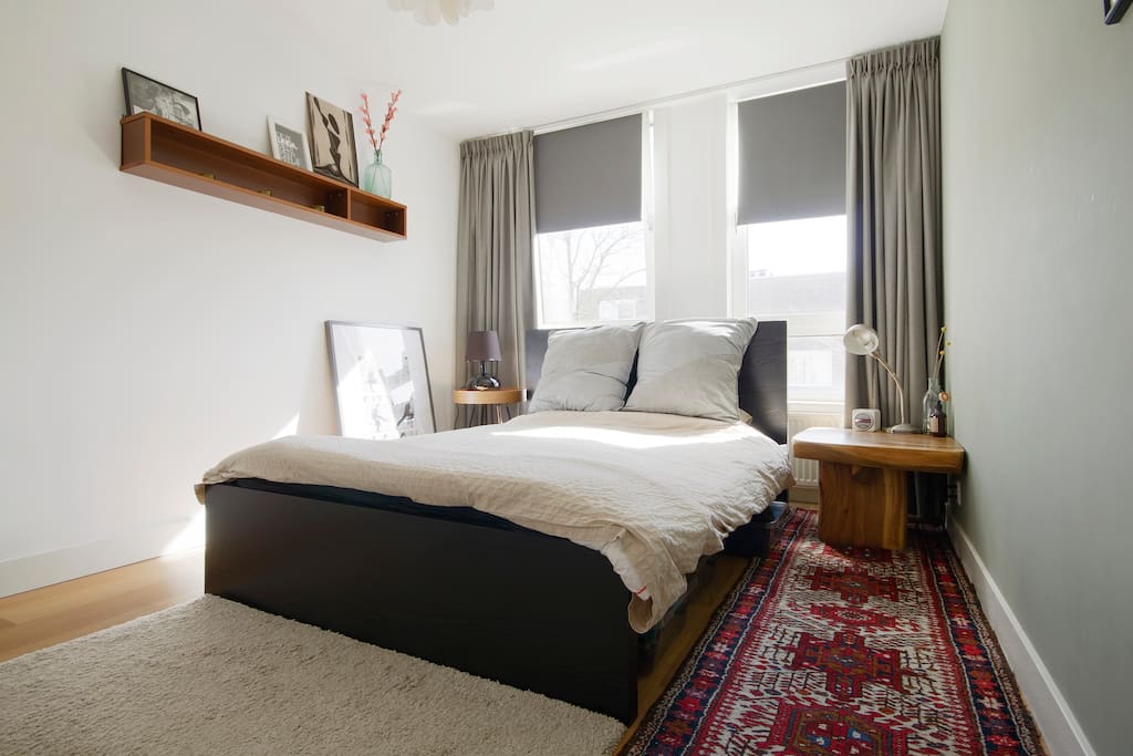 Quit and dark bedroom with comfy blankets