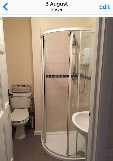 Shower room next door to room 2 (2 single beds) and room 3 (bunk beds)