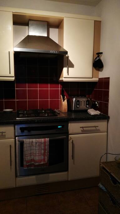 Kitchen includes a washing machine and a dryer