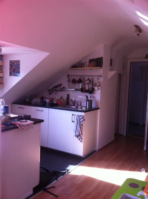 Kitchen corner just in front of the table.