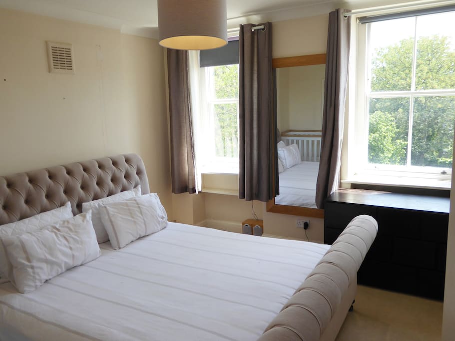 Superking size bed with blackout blinds and huge full-length mirror