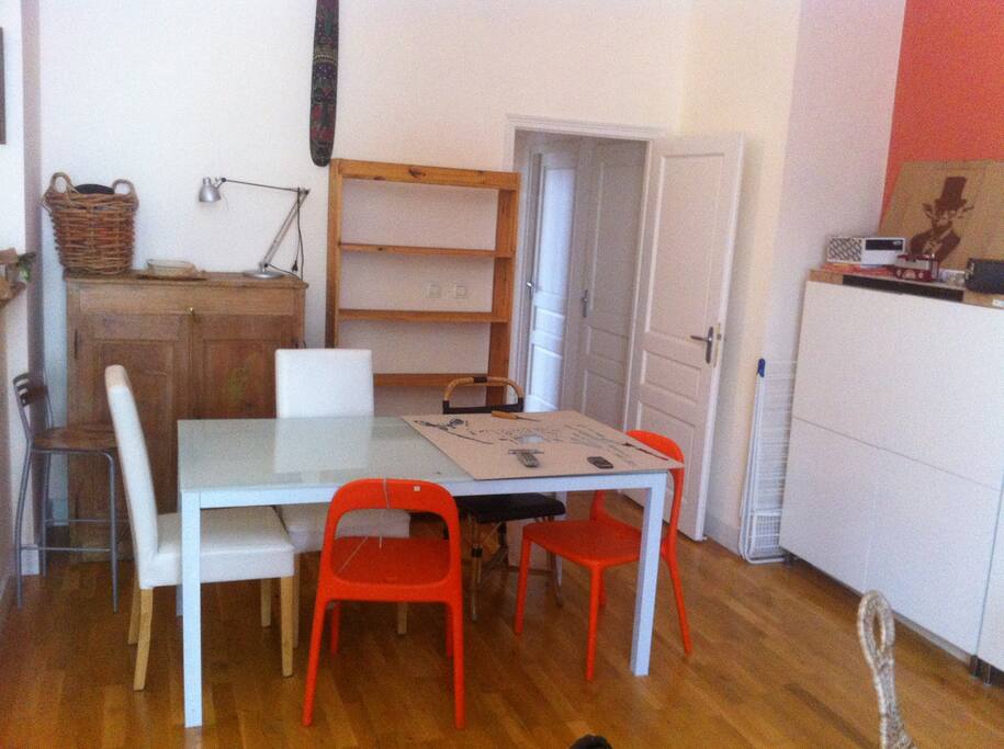 Living area, large dining table and chairs