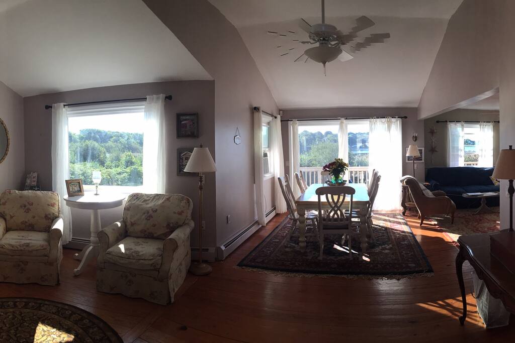 View from front door entry. Sitting area to left, dining room in center.