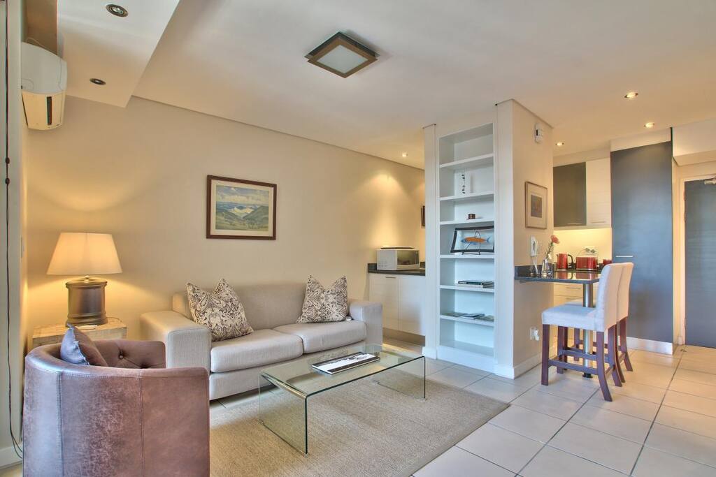 Neat spacious lounge with air conditioner.