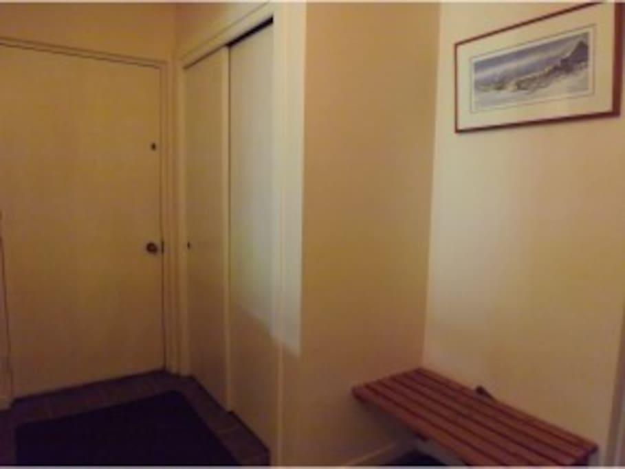 Entryway with large closet and bench