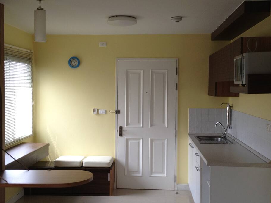 Cupboard ,microwave,refrigerator, water refinery and a sink
