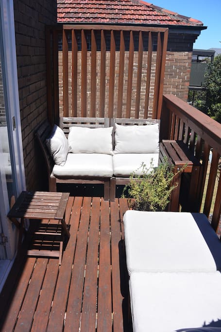 Private balcony area with seating leading from kitchen creating indoor/outdoor living