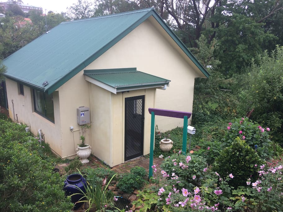 Mini house in garden setting. Has everything needed for a relaxing stay. Let us know if we can do anything to make your stay more enjoyable.
