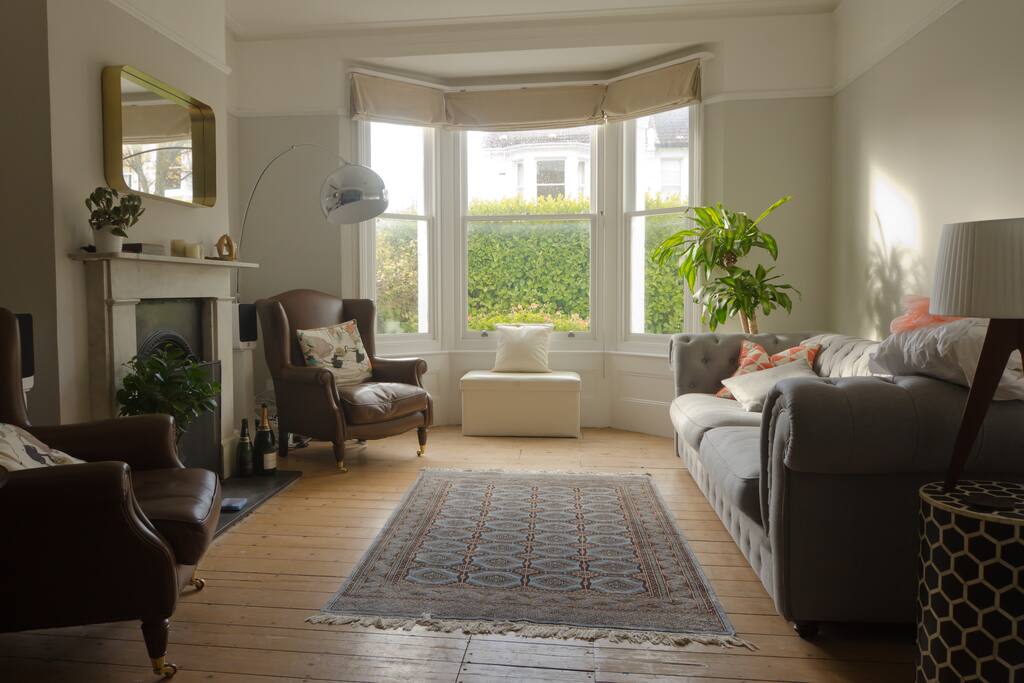 Relax by the fire in the leather wingbacks