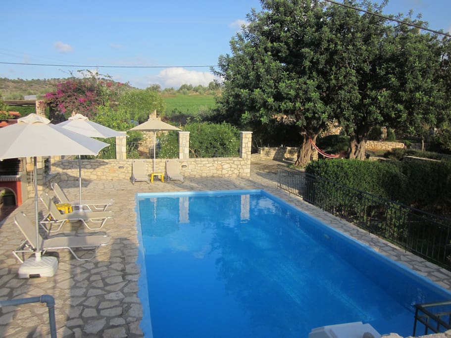 Large stone terrace with private swimming pool and garden