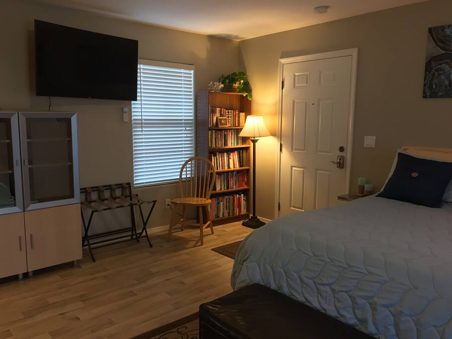 50" curved smart TV can be rotated to point towards the bed or the kitchen table.