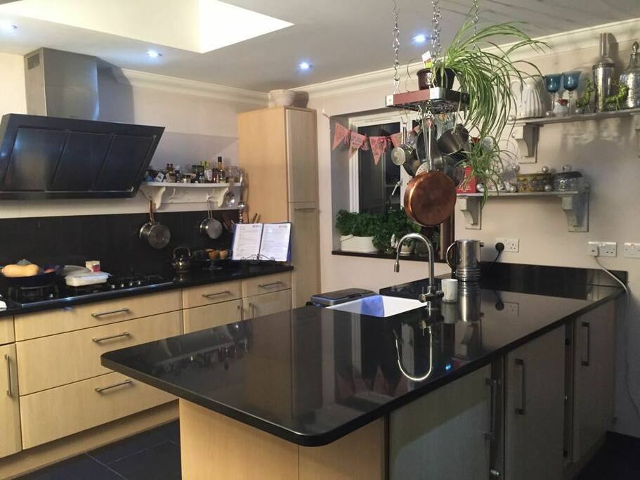 Open plan kitchen and dining room (pic taken at night). Dining area not shown.
