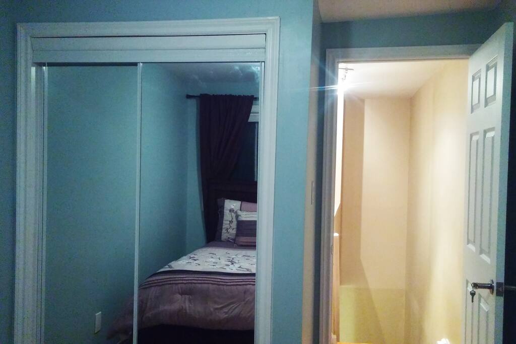 Closet w/ full length mirrors on both doors