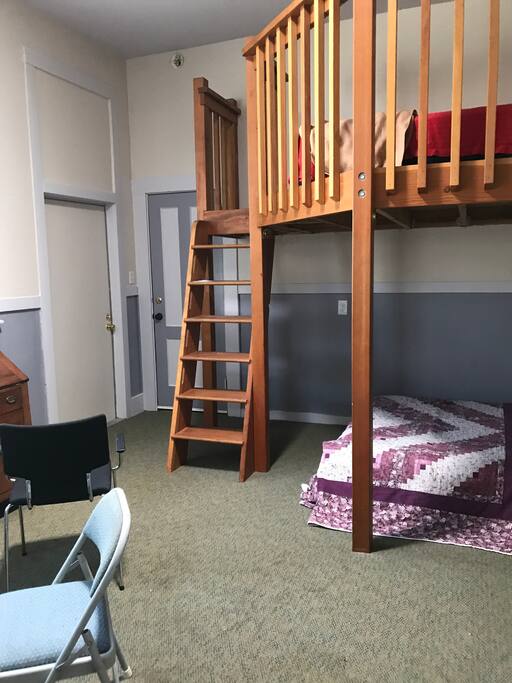 11 foot ceilings, 2 full length windows, frosted and curtained for privacy.