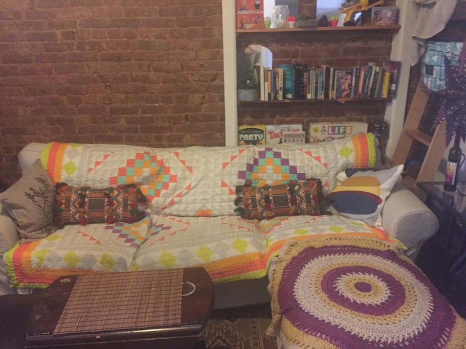Extremely comfortable couch can be made up into a lovely bed for sleeping!