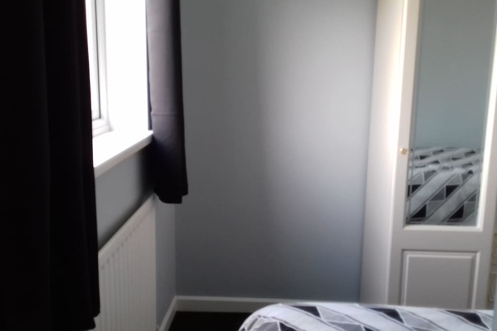 Window for natural light and blackout curtains