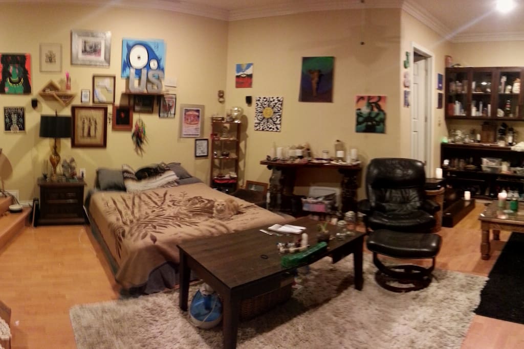 Panorama of the sleeping area, reclining chair, the stairs to the right lead to the bathroom