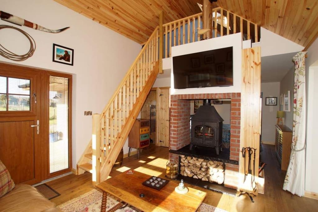 Living Area with 46" flat screen TV & open fire