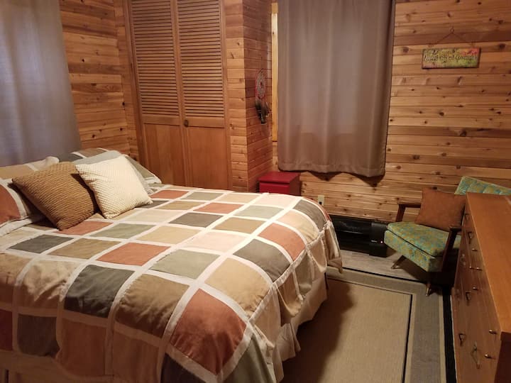 Master bedroom - Paneled in rustic pine.