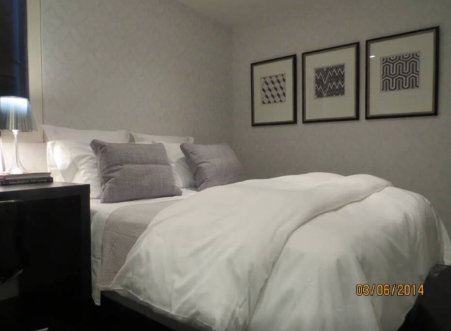 Comfortable queen bed with desk