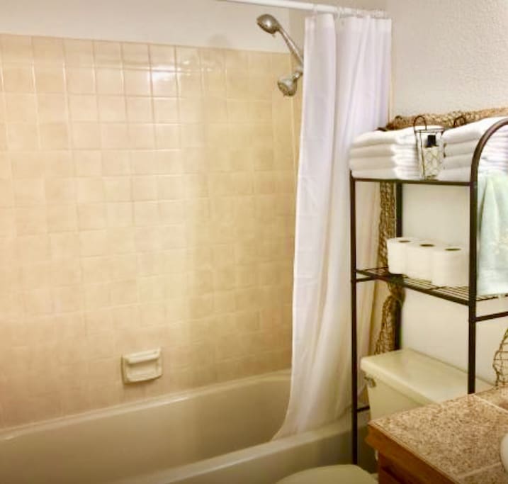 Sparkling clean bathroom with plenty of toiletries, towels, environmental/gentle soaps,shampoo and conditioner.