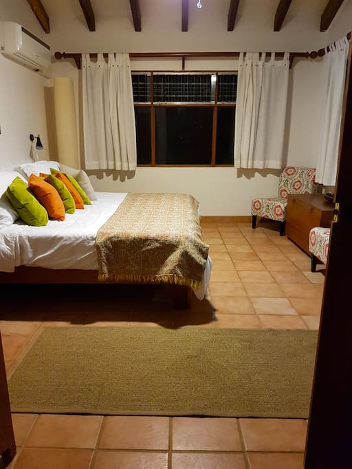 Spacious Master Bedroom with Comfortable King size Bed & Fine Quality Linens, Large Closets, Ocean & Garden Views.
