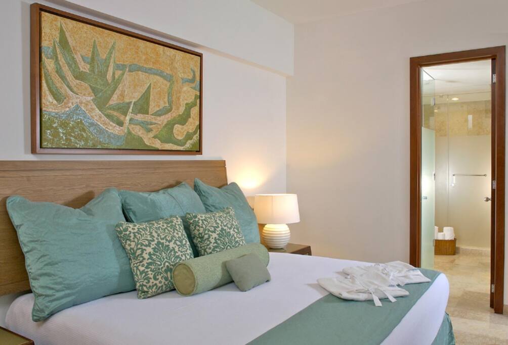Overview of bed area with bathroom