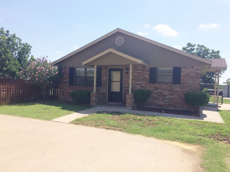 Front of house with private drive and porches