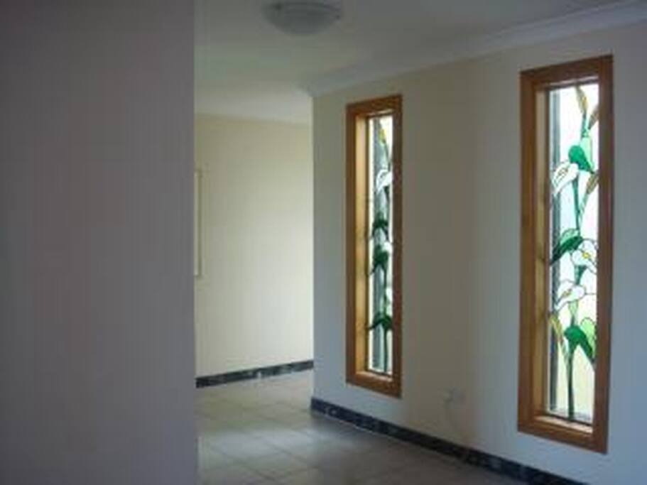 Beautiful stained glass windows in living area.