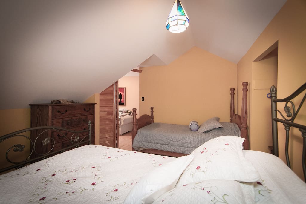 This bedroom features a single bed and a double bed and can sleep a total of 3 people.