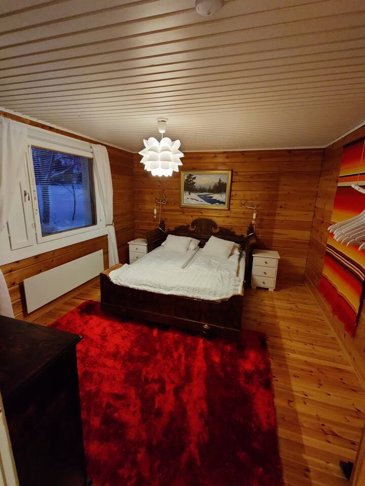 Master bedroom with queen size bed. This room also has a small TV. 