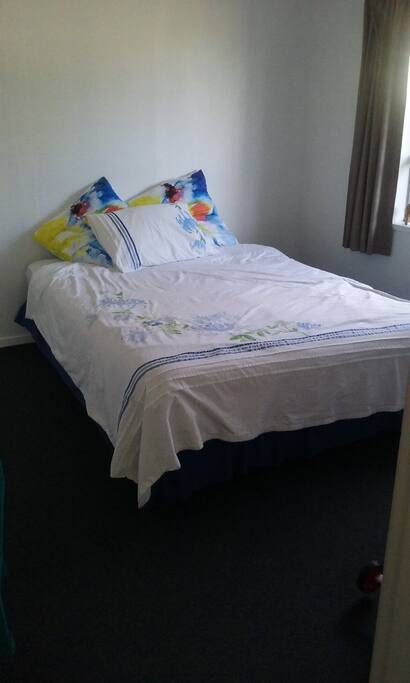 Queen size bed, in clean comfortable room.