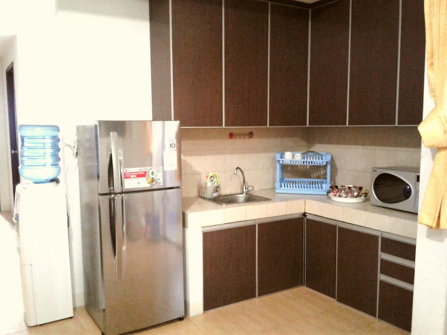 Kitchen with microwave and refrigator