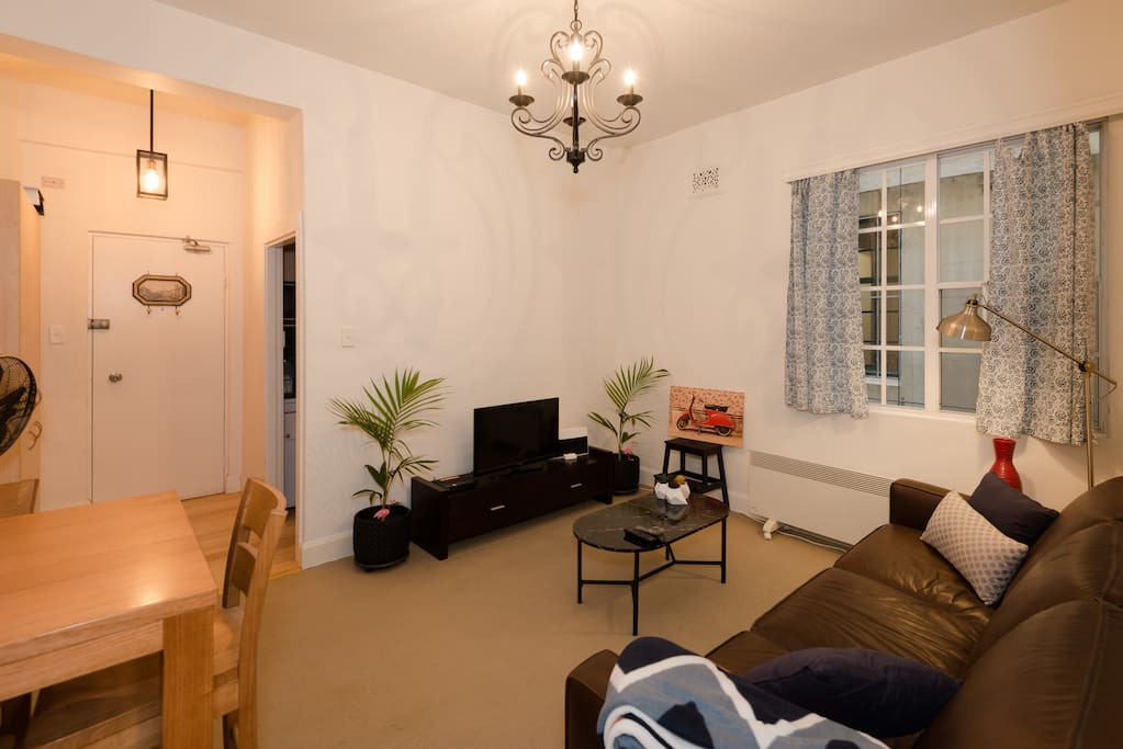 Lounge room. Couch, Tv, heater.