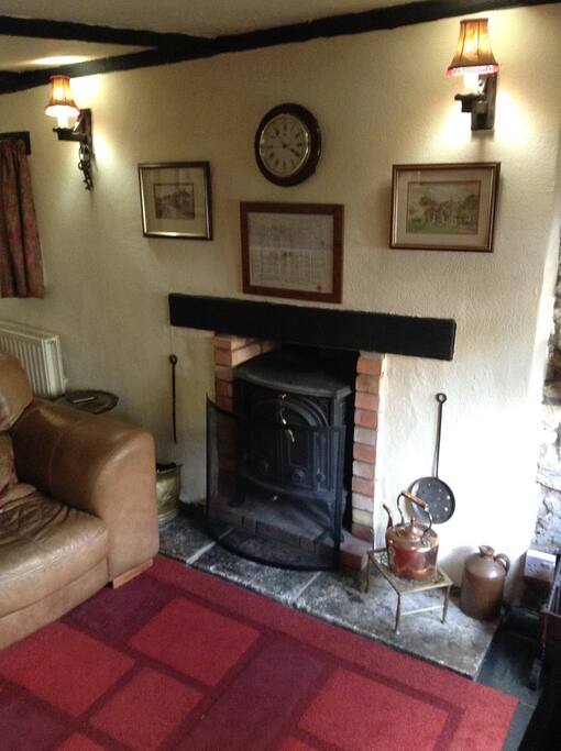 Lounge with solid fuel stove
