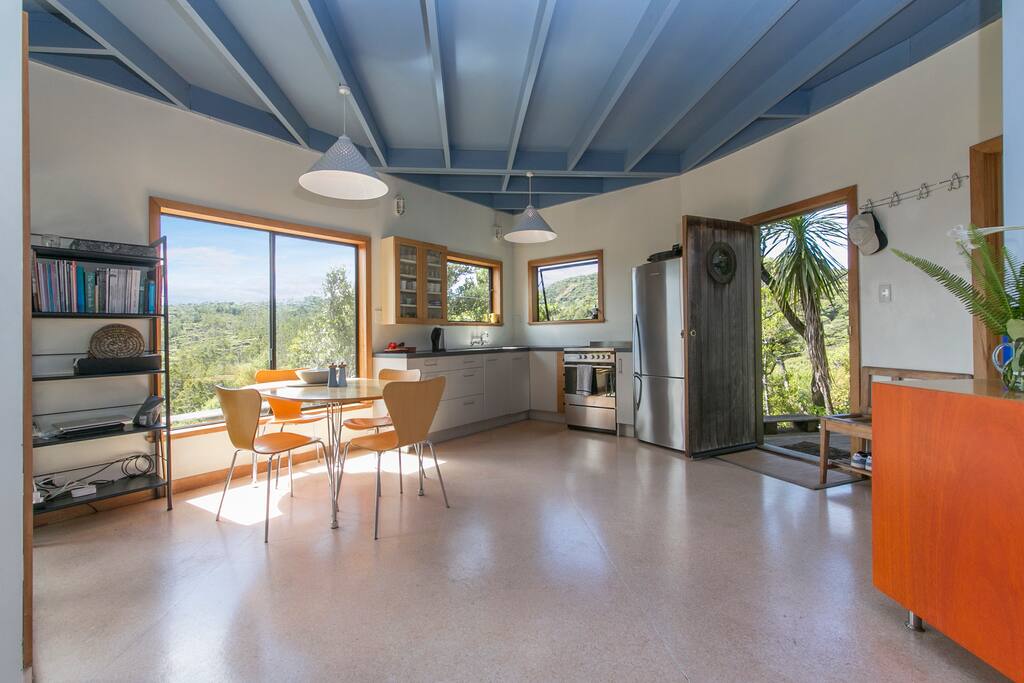 Open-plan kitchen, dining, living area.