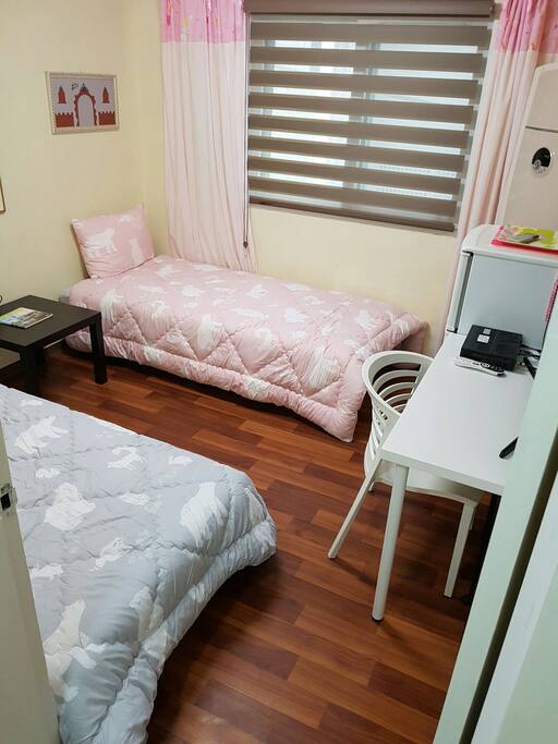 Two beds and tables.