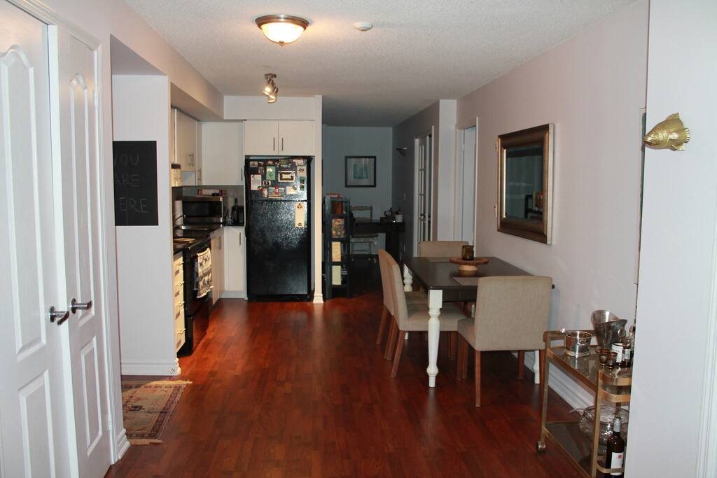 Complete with a bar cart, the dining space leads to a personal workspace