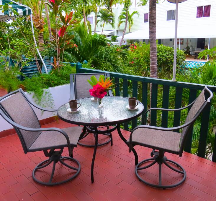 Patio at villa entrance overlooking pool