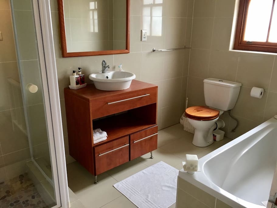 Full bathroom with shower and bath