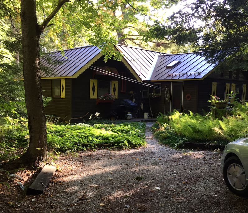 back of cottage, parking area with room for 3 cars