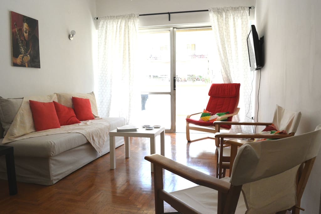 sunny living room with a double sofa bed